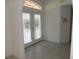 Bright entryway with tile flooring, a transom window above the door, and an arched doorway at 388 Orlando Blvd, Port Charlotte, FL 33954