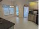 The kitchen has ample counter space with a door leading to the pool area for outdoor dining convenience at 388 Orlando Blvd, Port Charlotte, FL 33954