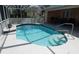 Beautiful screened-in pool with inviting steps, surrounded by a spacious deck area with outdoor seating at 388 Orlando Blvd, Port Charlotte, FL 33954