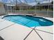 Inviting screened-in pool with bright blue water, surrounded by a clean, white pool deck at 388 Orlando Blvd, Port Charlotte, FL 33954