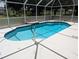 Sparkling screened-in pool with clear blue water and walk-in steps, perfect for relaxation and recreation at 388 Orlando Blvd, Port Charlotte, FL 33954