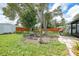 Charming backyard fire pit area with seating, ideal for enjoying evenings outdoors with friends and Gathering at 4062 Blitzen Ter, North Port, FL 34287