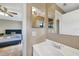 Bathroom features a sink and mirror as well as access to the adjacent bedroom space at 4062 Blitzen Ter, North Port, FL 34287