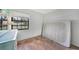 Bedroom with tiled floor and a window. A small desk and a mattress are in the room at 4062 Blitzen Ter, North Port, FL 34287