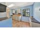 Bright kitchen features tile floors, wood countertops, neutral cabinets, and a window view at 4062 Blitzen Ter, North Port, FL 34287