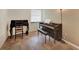 Small office features a piano and desk and tile flooring at 4062 Blitzen Ter, North Port, FL 34287