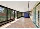 Enclosed sunroom with screen windows and tile flooring at 4062 Blitzen Ter, North Port, FL 34287