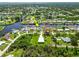 Aerial view of waterfront homes with private docks along winding canals in residential area at 4123 Rock Creek Dr, Port Charlotte, FL 33948