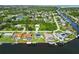 An aerial view showcases waterfront houses with private docks and beautiful canal access at 4123 Rock Creek Dr, Port Charlotte, FL 33948