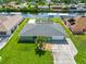 A beautiful single-Gathering home features a screened-in pool and is set on a manicured lawn at 4123 Rock Creek Dr, Port Charlotte, FL 33948