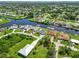 Scenic aerial view showcases canal-front homes nestled in a vibrant residential community at 4123 Rock Creek Dr, Port Charlotte, FL 33948