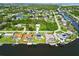 Aerial view of beautiful waterfront homes with private docks on a scenic canal community at 4123 Rock Creek Dr, Port Charlotte, FL 33948