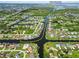 Aerial view of a waterfront community showing canal access to Charlotte Harbor and a public boat ramp at 4123 Rock Creek Dr, Port Charlotte, FL 33948