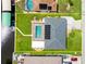 Aerial view highlighting property lines, screened pool, boat dock, and access to the canal at 4123 Rock Creek Dr, Port Charlotte, FL 33948
