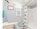 Neat bathroom with a decorative shower curtain and decorative wall accents at 4123 Rock Creek Dr, Port Charlotte, FL 33948
