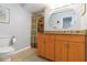 Neutral bathroom featuring a shower, tile floor, and wood vanity at 4123 Rock Creek Dr, Port Charlotte, FL 33948