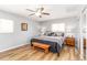Cozy bedroom with laminate flooring, ceiling fan, and natural light at 4123 Rock Creek Dr, Port Charlotte, FL 33948