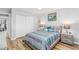 Comfortable bedroom features wood-look floors, stylish décor, and a closet at 4123 Rock Creek Dr, Port Charlotte, FL 33948