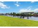 Waterfront backyard with a private boat dock overlooking serene canal views and lush landscaping at 4123 Rock Creek Dr, Port Charlotte, FL 33948
