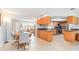 Open concept kitchen featuring wood cabinets and tile floors leading to dining area at 4123 Rock Creek Dr, Port Charlotte, FL 33948