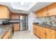 Bright kitchen with stainless steel appliances, granite countertops, and tile flooring at 4123 Rock Creek Dr, Port Charlotte, FL 33948