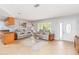 Bright living room with tile floors, plush seating, and view to the outdoors at 4123 Rock Creek Dr, Port Charlotte, FL 33948