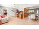 Open-concept living room and kitchen with tile flooring and a ceiling fan at 4123 Rock Creek Dr, Port Charlotte, FL 33948