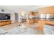 Spacious living area featuring an open layout to the kitchen and dining area at 4123 Rock Creek Dr, Port Charlotte, FL 33948