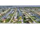 Stunning aerial view of the neighborhood and waterways with convenient access to the water at 4244 Harbor Blvd, Port Charlotte, FL 33952