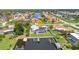 Aerial view of a waterfront property with a pool, private dock, and access to open water channels at 4244 Harbor Blvd, Port Charlotte, FL 33952