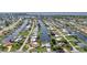 Great aerial view of the home and neighborhood showing proximity to the water and canals at 4244 Harbor Blvd, Port Charlotte, FL 33952