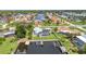 Aerial view of a waterfront property with a pool, private dock, and access to open water channels at 4244 Harbor Blvd, Port Charlotte, FL 33952