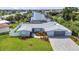 Aerial view of the property showcasing the backyard, canal, surrounding community and waterway access at 4244 Harbor Blvd, Port Charlotte, FL 33952