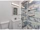 Bathroom featuring a vanity and a beautifully tiled glass shower with a built-in bench and niche at 4244 Harbor Blvd, Port Charlotte, FL 33952