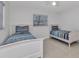 Bright bedroom featuring two twin beds, neutral walls, and a ceiling fan at 4244 Harbor Blvd, Port Charlotte, FL 33952