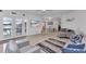 Open-concept living room flowing into dining area, polished floors, contemporary furnishings, and decor at 4244 Harbor Blvd, Port Charlotte, FL 33952