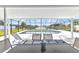 Covered patio with furniture overlooking the pool and waterfront at 4244 Harbor Blvd, Port Charlotte, FL 33952