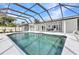 Screened pool, white patio and seating area at 4244 Harbor Blvd, Port Charlotte, FL 33952
