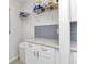 A bright storage area with white cabinetry and quartz countertops at 4244 Harbor Blvd, Port Charlotte, FL 33952