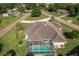 Aerial view of the property showcasing the pool, landscaping, and neighborhood at 437 South Dr, Punta Gorda, FL 33950