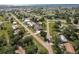 Aerial view of a home nestled among lush greenery in a quiet neighborhood near the water at 437 South Dr, Punta Gorda, FL 33950