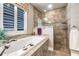 Relaxing bathroom features a large soaking tub and a separate glass-enclosed shower at 437 South Dr, Punta Gorda, FL 33950