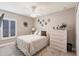 Comfortable bedroom with a ceiling fan, a window with shutters, and a dresser at 437 South Dr, Punta Gorda, FL 33950