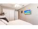 Bedroom with a ceiling fan, double closets, and a flat screen TV at 437 South Dr, Punta Gorda, FL 33950