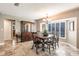 Elegant dining room with a classic wooden table set, complemented by a hutch and natural light at 437 South Dr, Punta Gorda, FL 33950