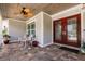 Inviting front entrance featuring a covered porch and decorative glass double doors at 437 South Dr, Punta Gorda, FL 33950