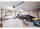 Well-organized garage with epoxy flooring, storage shelves, and ample space for vehicles at 437 South Dr, Punta Gorda, FL 33950