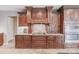 Custom kitchen with granite countertops, stainless appliances, and detailed cabinetry, blending style with functionality at 437 South Dr, Punta Gorda, FL 33950