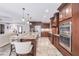 Beautiful kitchen with a central island, custom wood cabinets, and stainless steel appliances at 437 South Dr, Punta Gorda, FL 33950