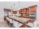Spacious kitchen features a large island with granite countertops, stainless steel appliances, and wood cabinetry at 437 South Dr, Punta Gorda, FL 33950